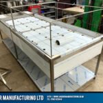 Framed Stainless Steel perforated mortuary table with integrated frame